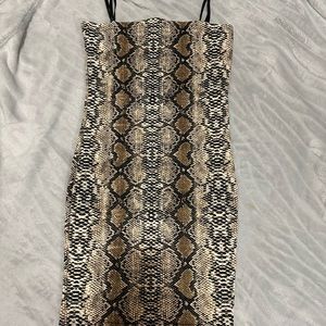 Snake print dress , body con, very flattering and unique